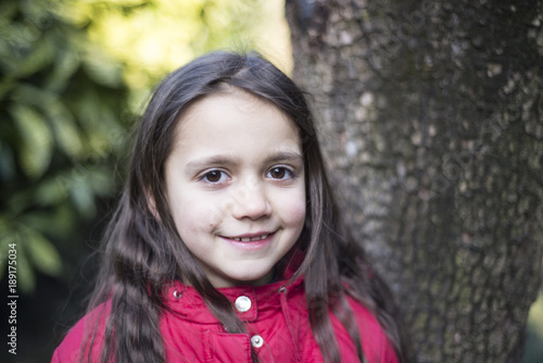 portrait of a little girl of 7 years on the outside