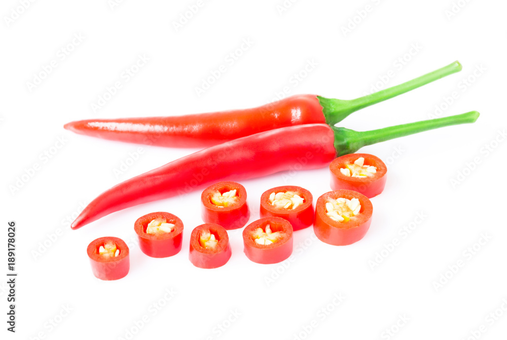Closeup top red chili pepper with sliced on white background, raw food ingredient concept Closeup top red chili pepper with sliced on white background, raw food ingredient concept
