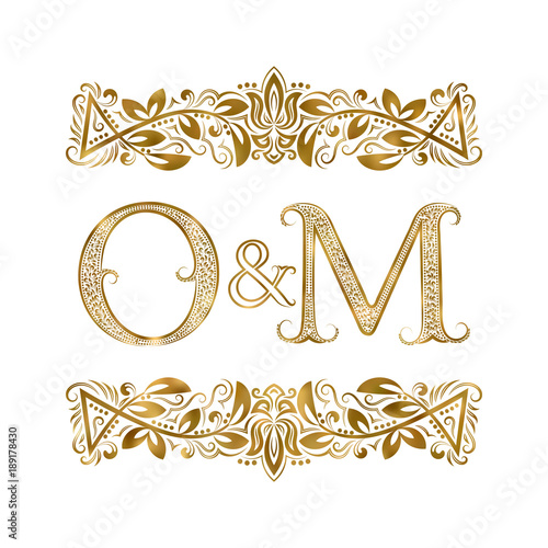 O and M vintage initials logo symbol. The letters are surrounded by ornamental elements. Wedding or business partners monogram in royal style.