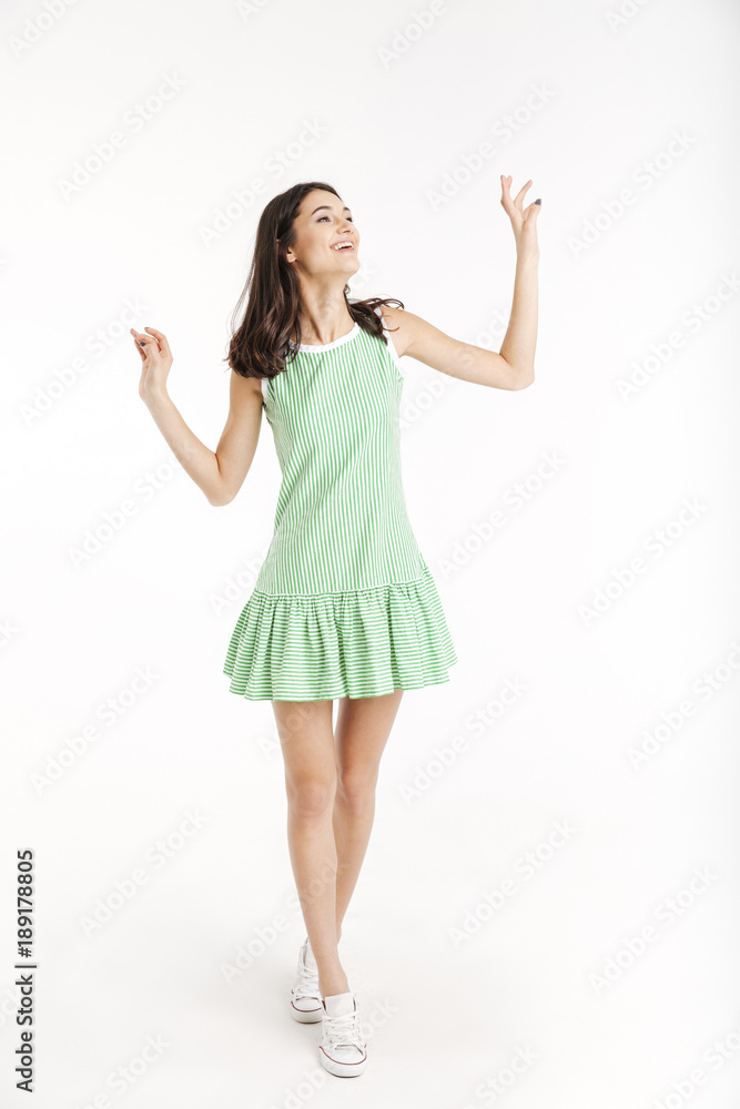 Full length portrait of a cheerful girl dressed in dress Full length portrait of a cheerful girl dressed in dress
