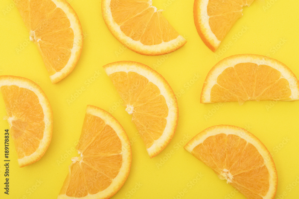 Fototapeta premium Orange slice isolated on orange background.