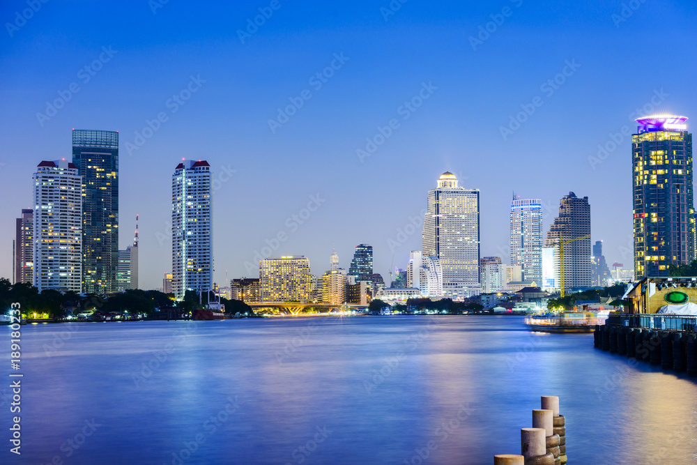 Bangkok and Chao Phraya River at dusk. Located near Asiatique The Riverfront Night Market and Asiatique Sky, Bangkok, Thailand.