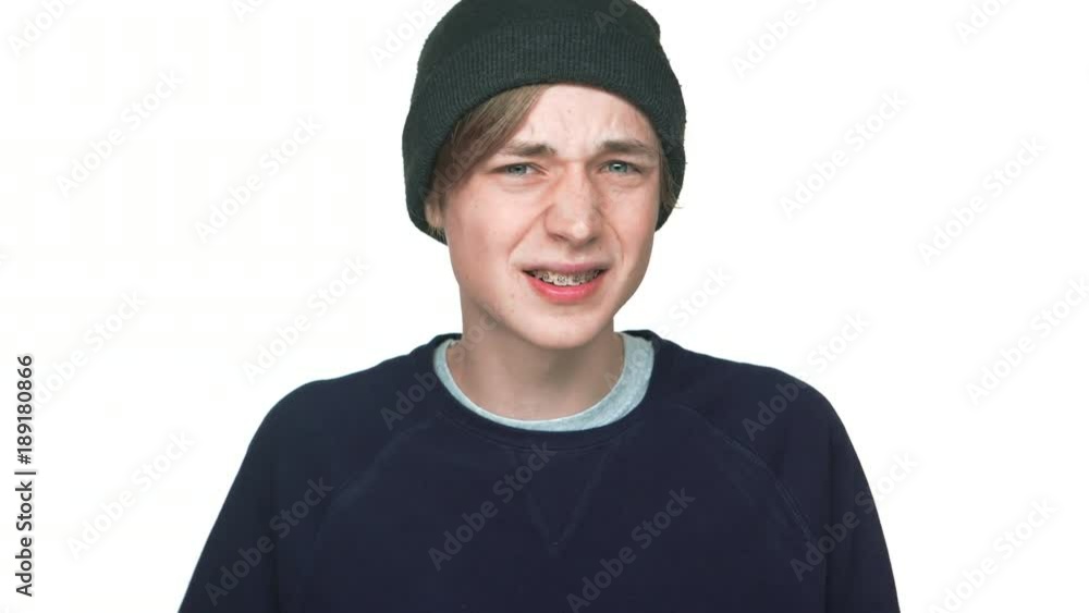 portrait of young disappointed man in casual clothes being surprised expressing outrage over white background closeup. Concept of emotions portrait of young disappointed man in casual clothes being surprised expressing outrage over white background closeup. Concept of emotions