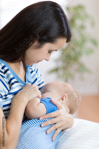 Young mother holding her ne...