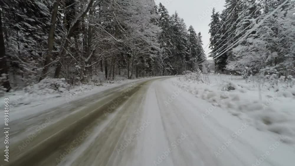 Driving on curvy snowy road, front camera on car Driving on curvy snowy road, front camera on car