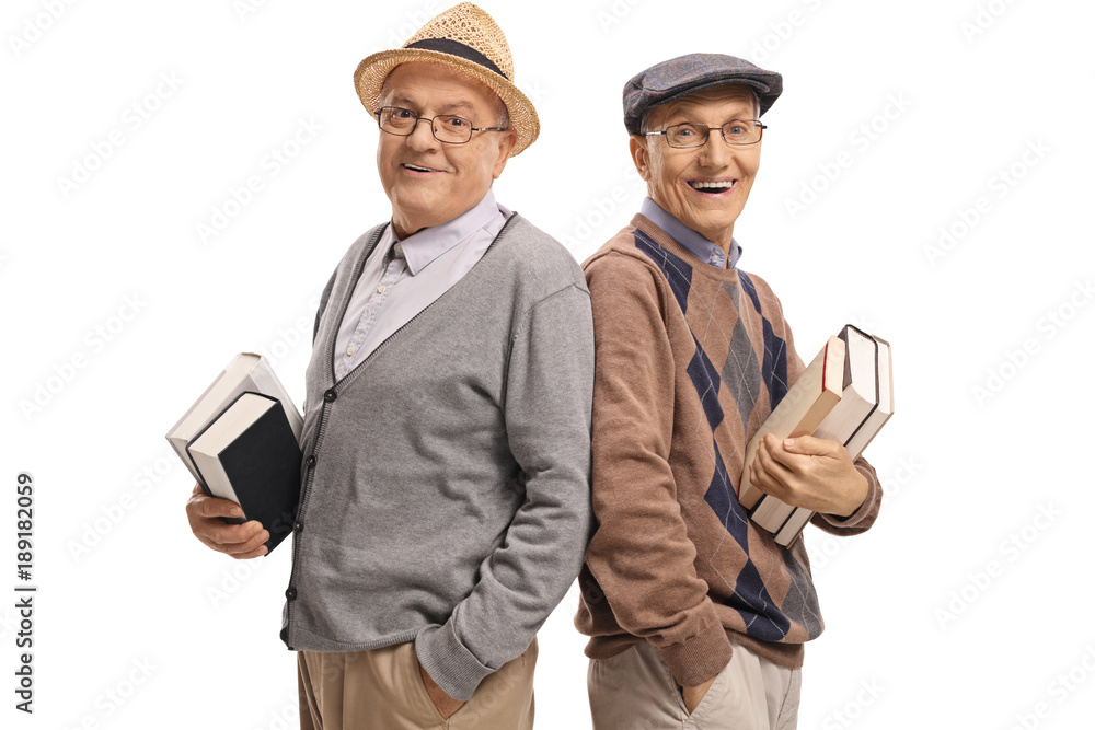 Seniors with books looking at the camera and smiling Seniors with books looking at the camera and smiling