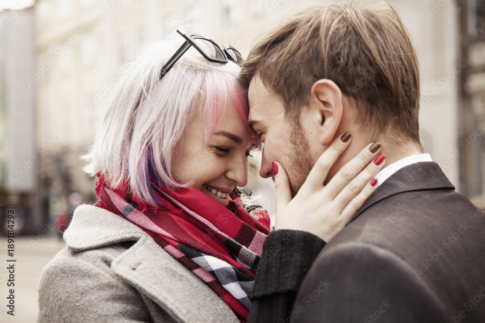 Fototapeta premium Long-awaited meeting of the two lovers. Portrait of emotional young couple in love hugging each other. (happiness, love, romance, sensuality concept)