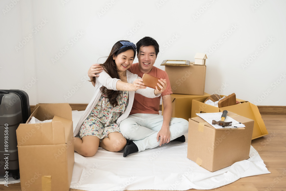 happy couple taking selfie in new home happy couple taking selfie in new home