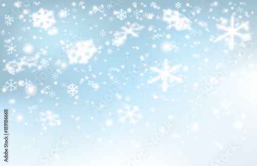 Falling snow on a light blue background.