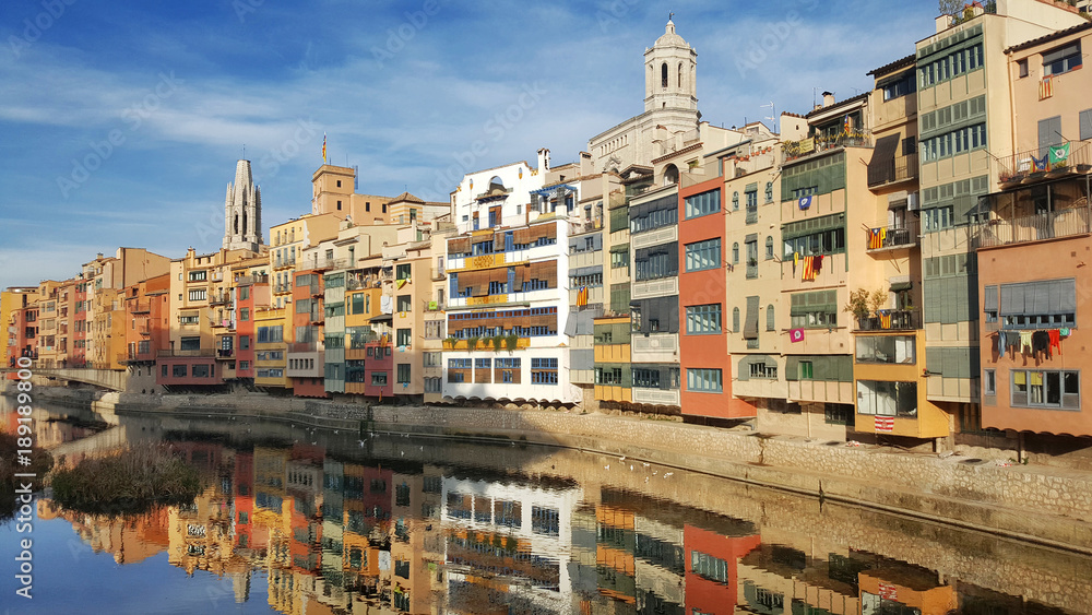 Colorful Houses Reflecting on the Onyar River
