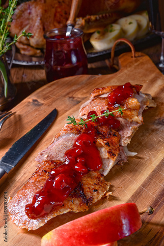 fried duck breast with cranberries photo