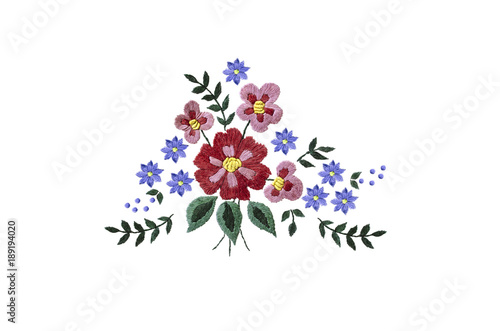 Embroidery bouquet of red and purple flowers and leaves on white background

