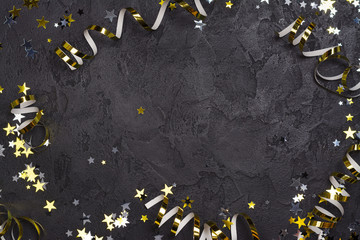 Bright festive carnival background with hats, streamers, confetti and balloons