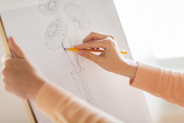 artist with pencil drawing picture at art studio