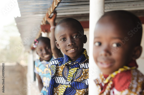 Three African Children Smiling and Laughing outdoors photo