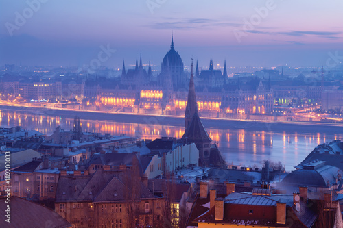 Photography Budapest Parliament building view in morning blue haze across the river