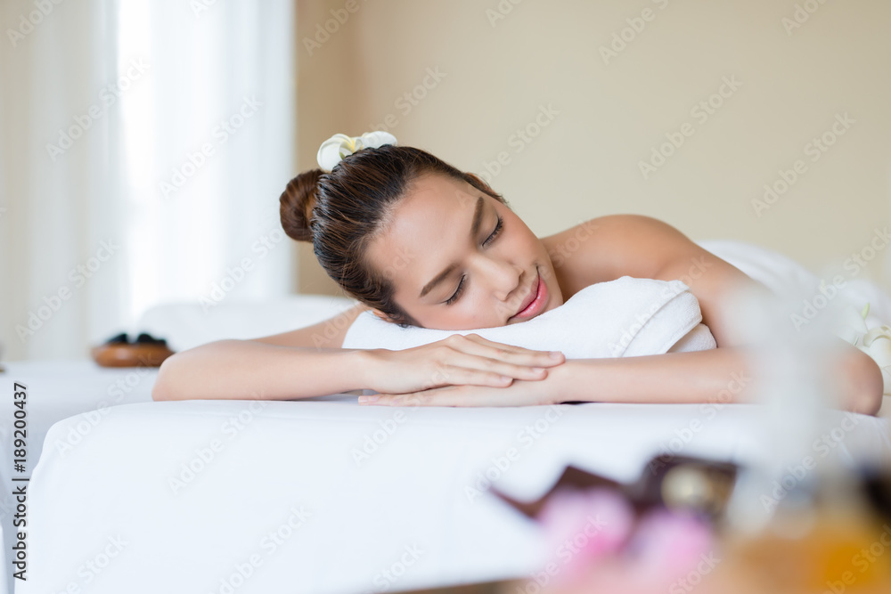 Young beautiful Asian woman relaxing in the spa. Young beautiful Asian woman relaxing in the spa.