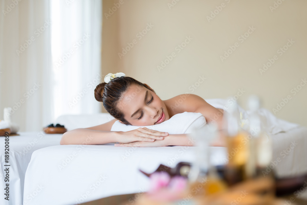 Young beautiful Asian woman relaxing in the spa. Young beautiful Asian woman relaxing in the spa.