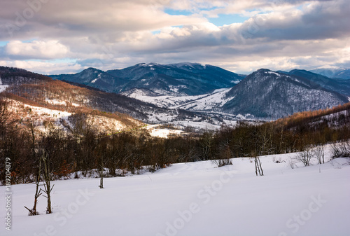 Wallpaper Mural beautiful mountainous countryside in afternoon. gorgeous winter landscape with cloudy sky and snowy slopes Torontodigital.ca