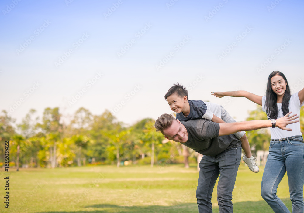 Dad and son having fun outdoors.concept of a happy family. Dad and son having fun outdoors.concept of a happy family.