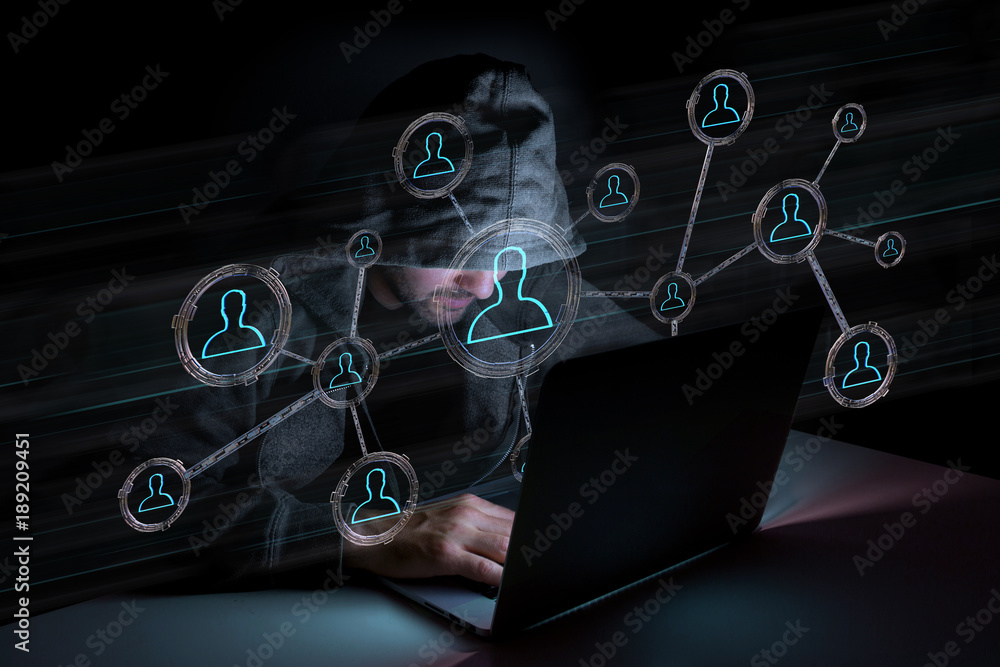 Hacker man in the dark using computer to hack data and information system Hacker man in the dark using computer to hack data and information system