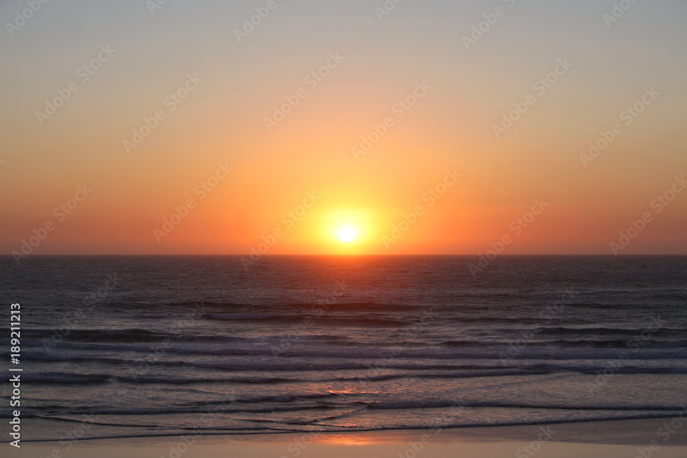 Coast of the sea at colorful sunset. Yellow Sun Set in The Middle of The Ocean