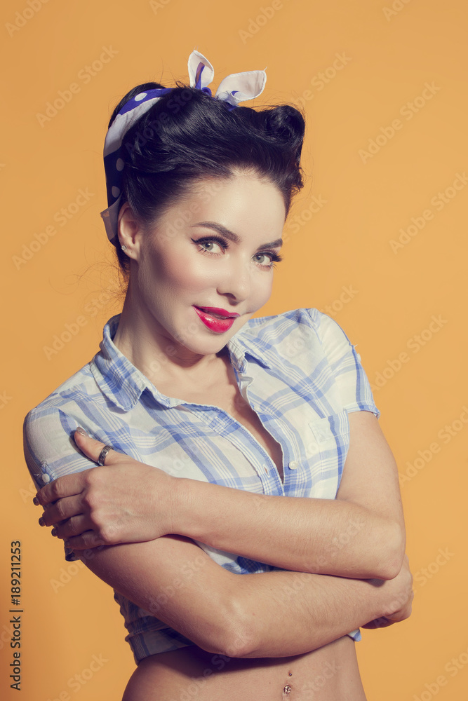 girl in pin-up style hugging his hands girl in pin-up style hugging his hands