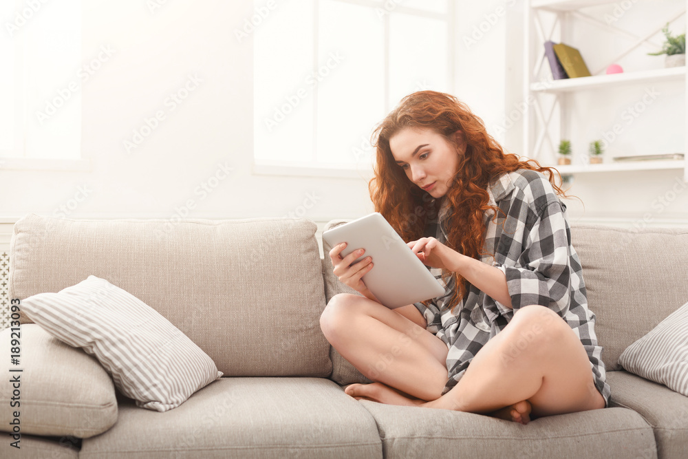 Young girl with digital tablet at home Young girl with digital tablet at home
