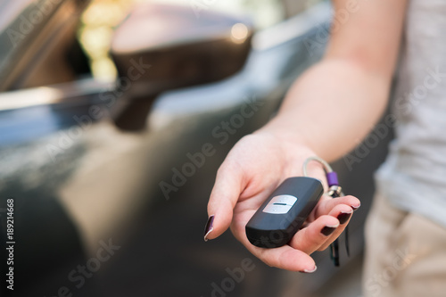 Car remote on hand. Giving car remote to someone concept