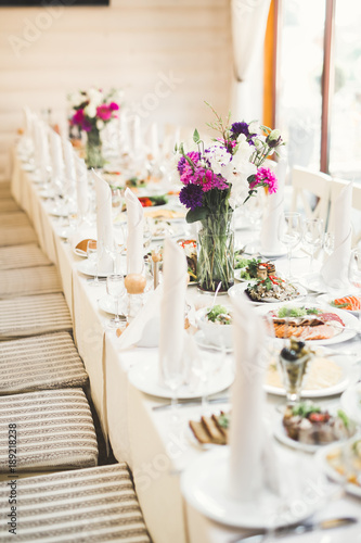 Interior of a restaurant prepared for wedding ceremony © olegparylyak