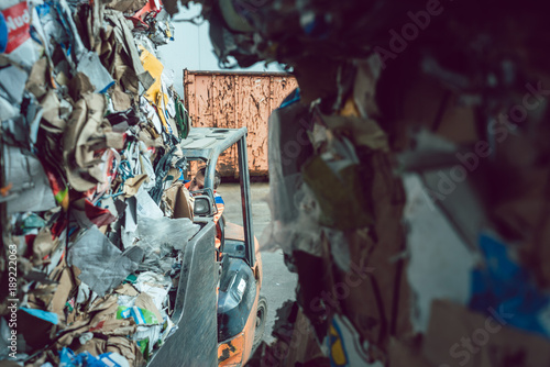 Cardboard and paper having been separated in waste reclamation plant