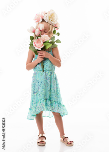 little blonde girl with flowers