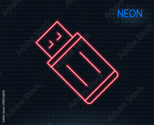 Neon light. USB flash drive line icon. Memory stick sign. Portable data storage symbol. Glowing graphic design. Brick wall. Vector