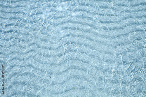 Transparent sea water and white sandy bottom.