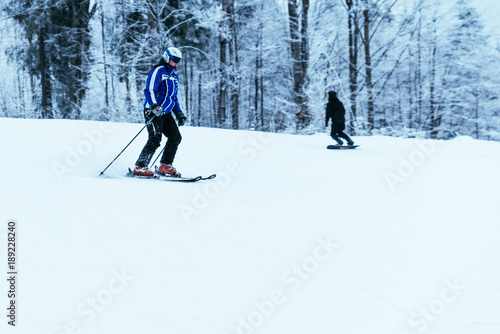 people skiing and snowboarding at winter mountains