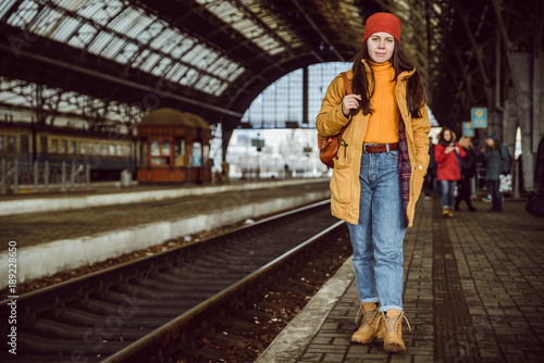 woman walk by railway station