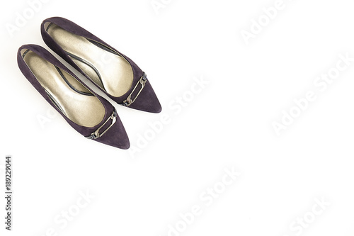 Fashionable medium heeled women's leather wedge shoes isolated on white.