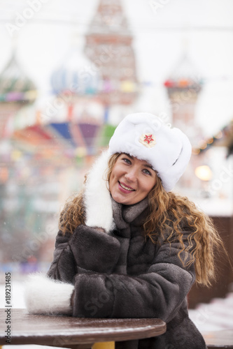 Portrait of a young beautiful girl in a white hat © Andrey_Arkusha