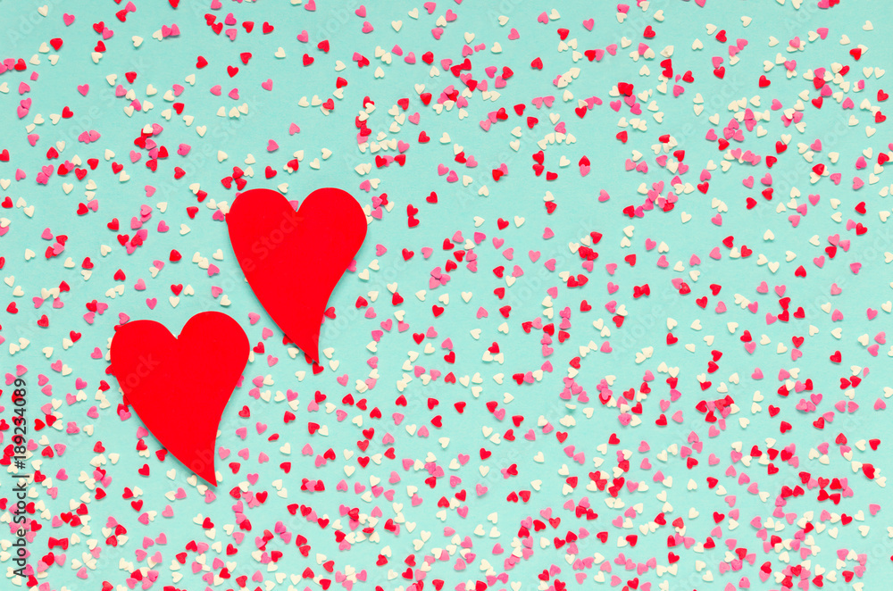 Background of colorful hearts with two red hearts