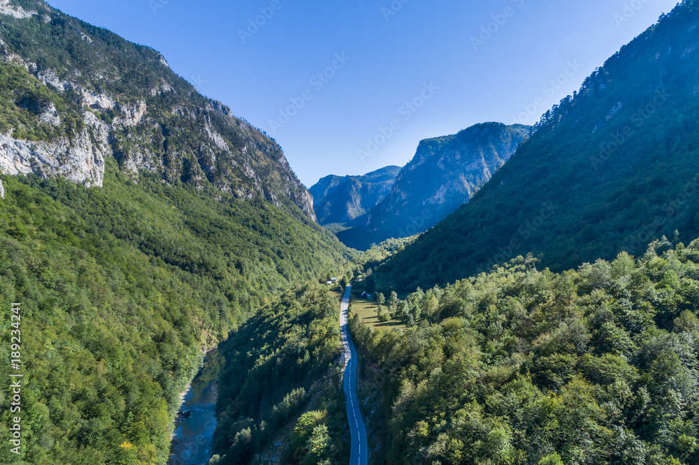 aerial view of the canyon with the river and the road in the mountains of Montenegro aerial view of the canyon with the river and the road in the mountains of Montenegro