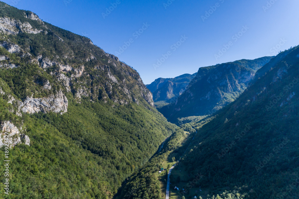 aerial view of the canyon with the river and the road in the mountains of Montenegro