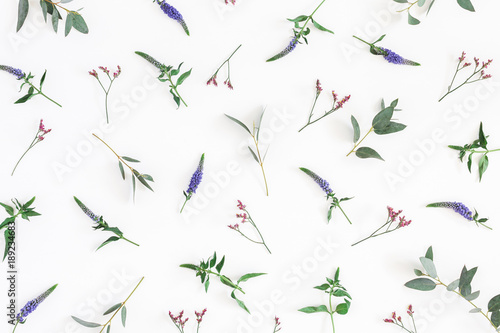Flowers composition. Pattern made of purple and pink flowers on white background. Flat lay, top view