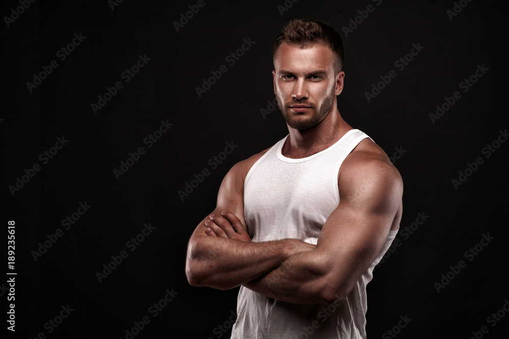 Portrait of athletic man in white undershirt Portrait of athletic man in white undershirt