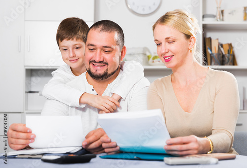 Smiling family with papers