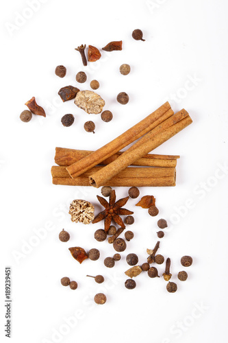 Wallpaper Mural Spices for mulled wine. Spices for mulled wine isolated white background. Cinnamon sticks, roast pepper, ginger, tubberry, nutmeg, cardamom, cloves. Torontodigital.ca