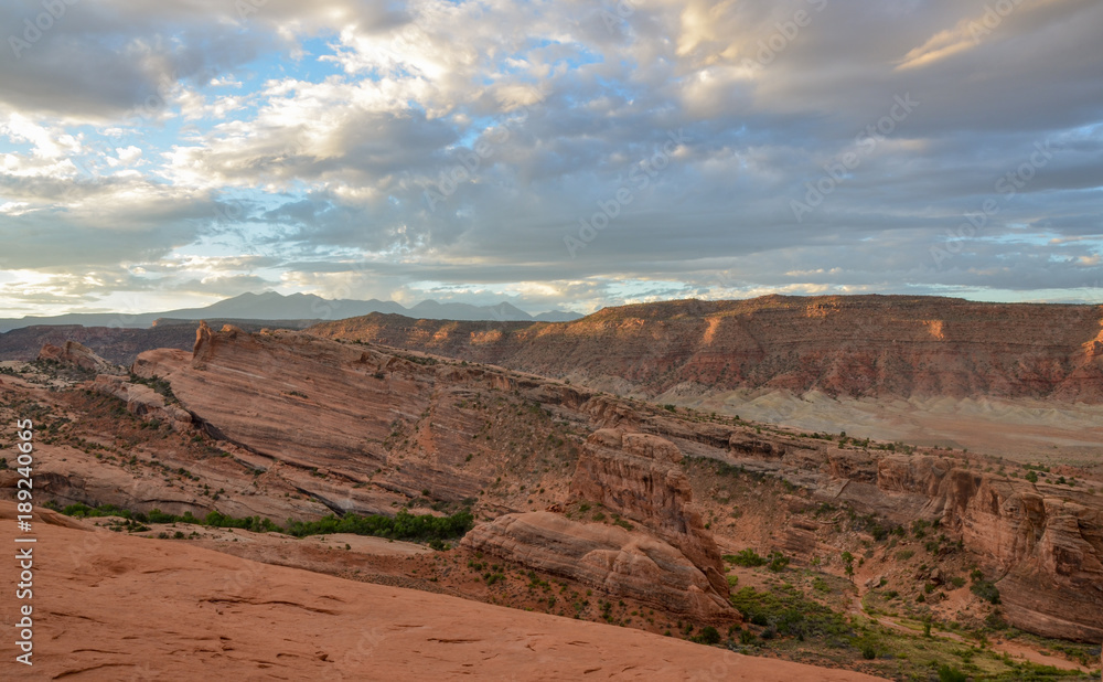 blue sky and clouds over cliffs of Salt Valley at sunrise panoramic view from Delicate Arch
Arches National Park, Moab, Utah blue sky and clouds over cliffs of Salt Valley at sunrise panoramic view from Delicate Arch
Arches National Park, Moab, Utah