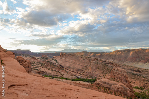 cliffs of Salt Valley at sunrise panoramic view from Delicate Arch Arches National Park, Moab, Utah © ssmalomuzh