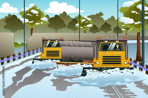 Snow Plow Trucks Clearing The Road From Snow