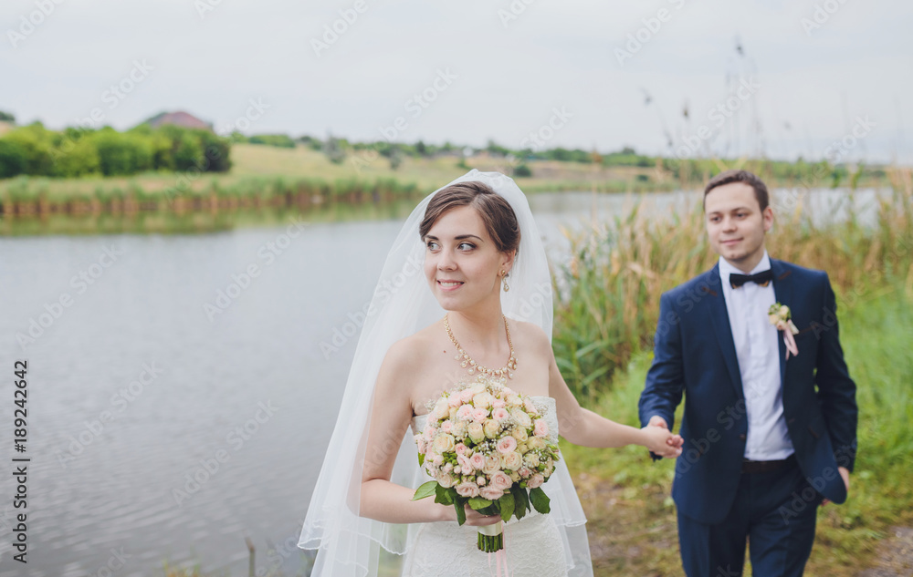 Groom and Bride in a park. wedding dress. Groom and Bride in a park. wedding dress.