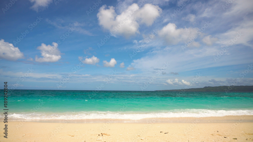 Beach, sea, sand,wave. Tropical beach, blue sky, clouds. Seascape ocean and beautiful beach paradise. Philippines Boracay Travel concept